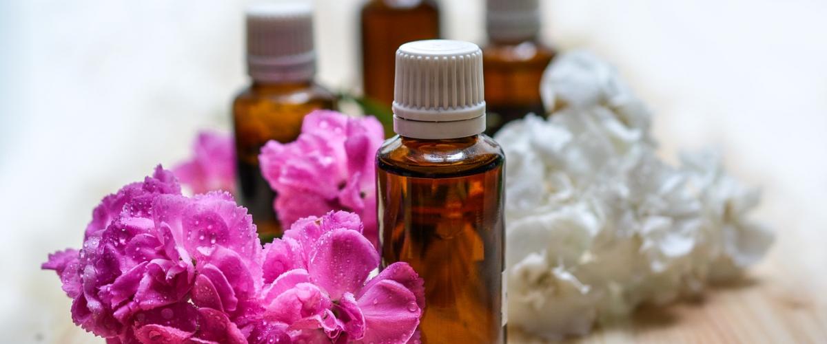 Small bottles surrounded by flowers