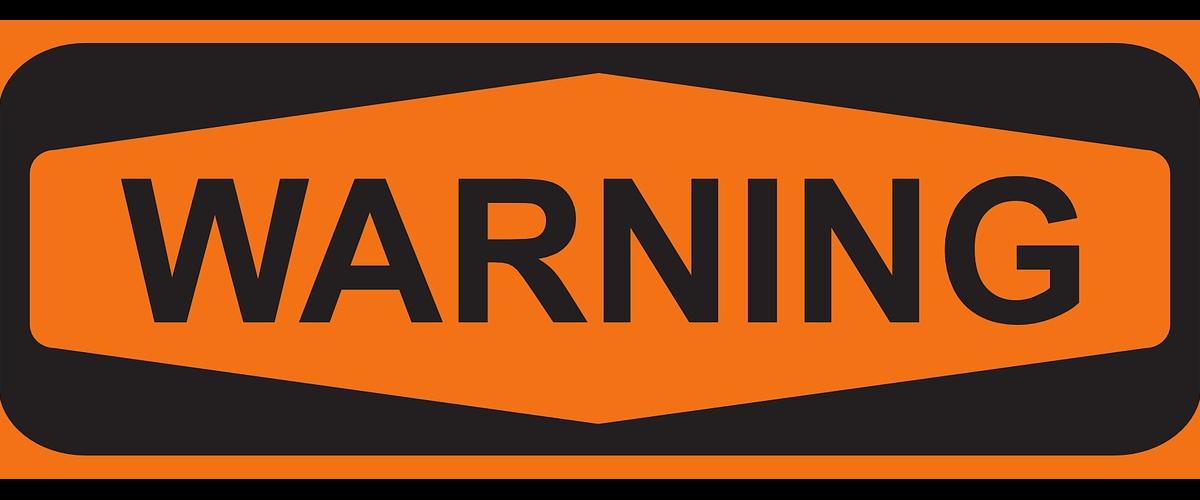 Black and orange warning sign