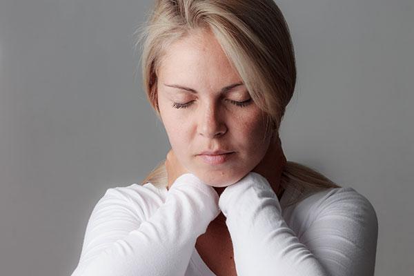 Meningitis Image - Young woman with neck pain