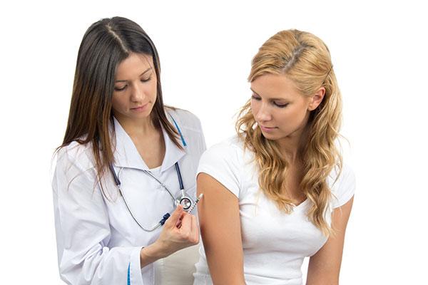 Workforce flu image - Woman receiving shot