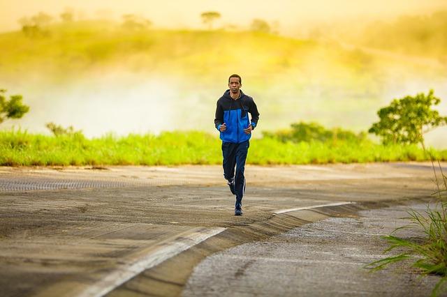 Man running along a road